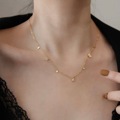 Gold Dangle Charm Choker Necklace with Baguette Zircon & Geometric Charms