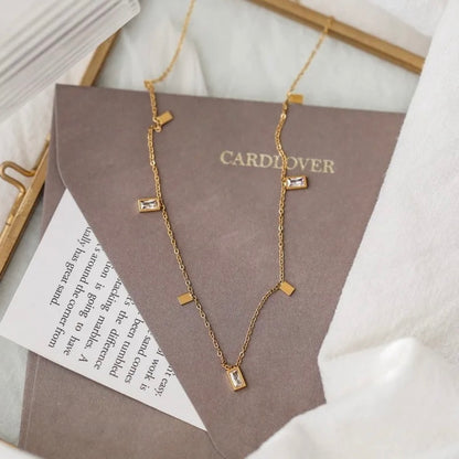 Gold Dangle Charm Choker Necklace with Baguette Zircon & Geometric Charms